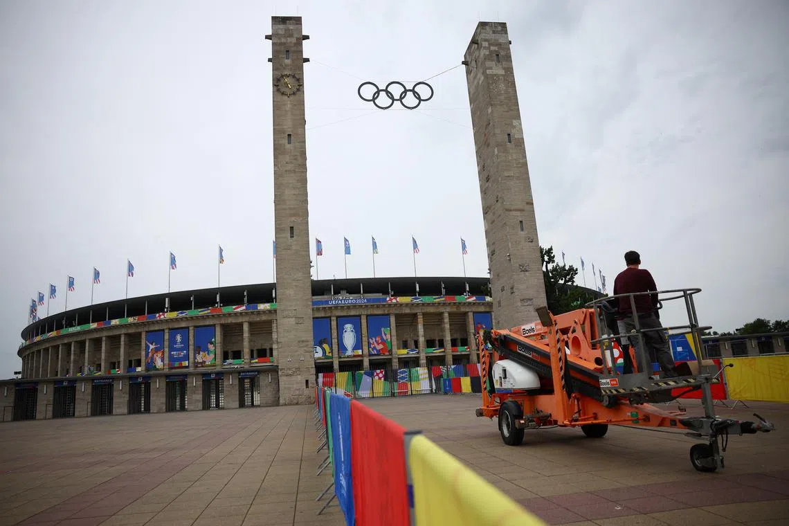 Soccer Football - Euro 2024 Previews - Berlin Olympiastadion, Berlin, Germany - June 14, 2024 Workers prepare the stadium ahead of the Spain v Croatia match REUTERS/Kacper Pempel