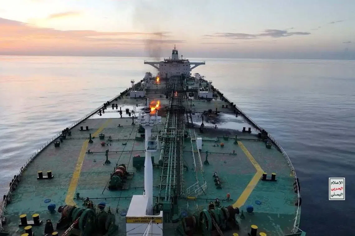 Flames and smoke rising from Greek-flagged oil tanker Sounion in the Red Sea, in this picture released Aug 29, 2024. 