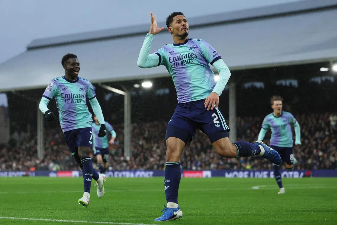 Arsenal's William Saliba celebrates after scoring against Fulham in their Premier League clash.