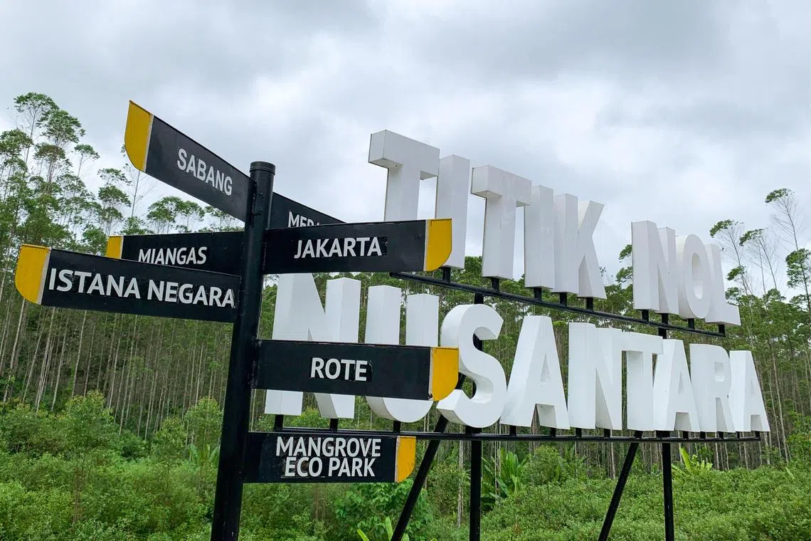 This picture taken on August 14, 2022 shows directions at Titik Nol Nusantara (ground zero Nusantara), the future capital city for Indonesia, in Sepaku, Penajam Paser Utara, East Kalimantan. - Located in eastern Borneo -- the world's third-largest island -- Nusantara is set to replace sinking and polluted Jakarta as Indonesia's political centre by late 2024. (Photo by Adek BERRY / AFP) / TO GO WITH Indonesia-environment, SPECIAL REPORT by Marchio Gorbiano and Dessy Sagita