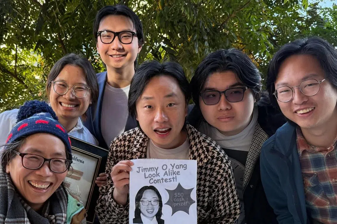 Jimmy O. Yang (middle) with participants at his own lookalike contest.