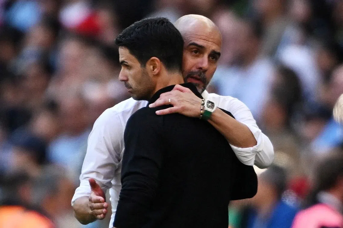 Soccer Football - Community Shield - Manchester City v Arsenal - Wembley Stadium, London, Britain - August 6, 2023  Manchester City manager Pep Guardiola with Arsenal manager Mikel Arteta at full time REUTERS/Dylan Martinez/File Photo