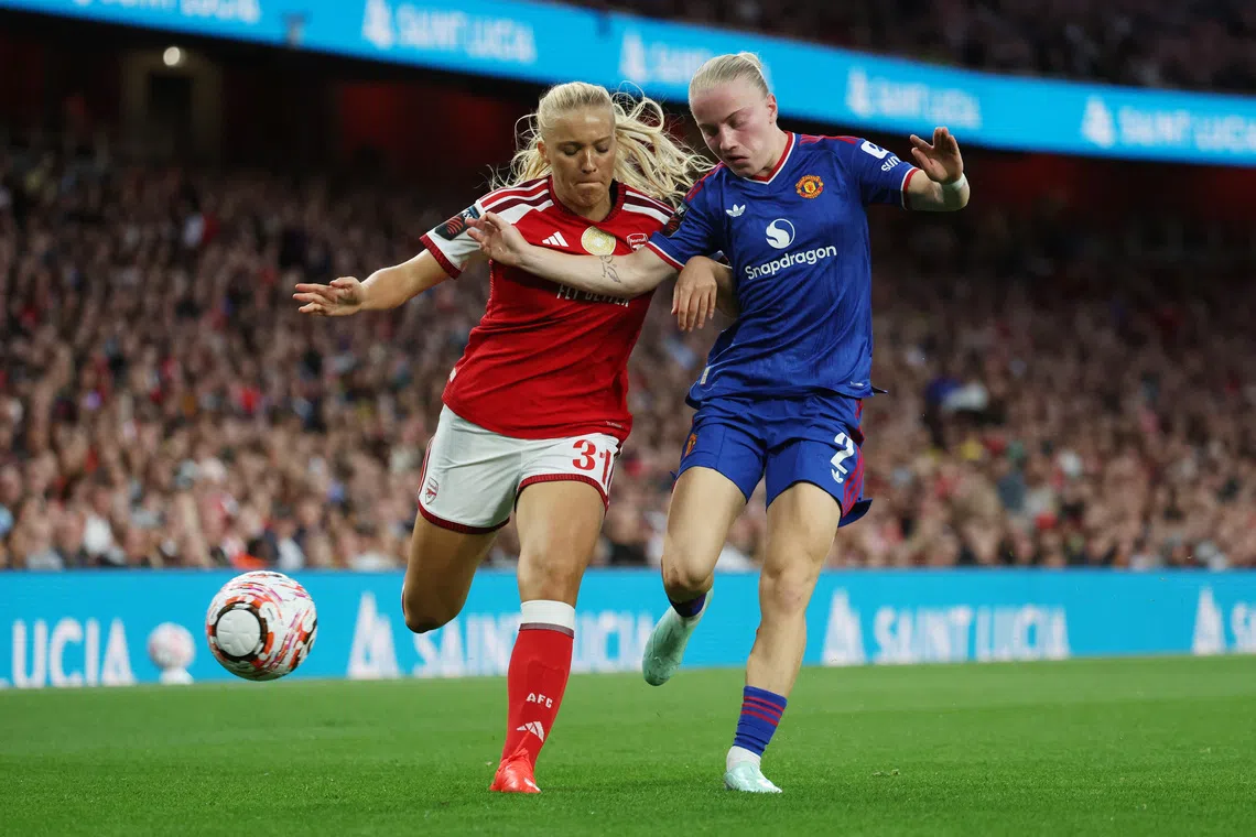 Soccer Football - Women's Super League - Arsenal v Manchester United - Emirates Stadium, London, Britain - September 19, 2026 Arsenal's Smilla Holmberg in action with Manchester United's Anna Sandberg Action Images via Reuters/Cat Goryn