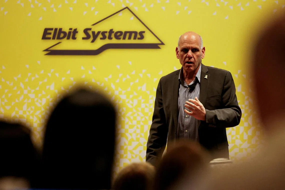 FILE PHOTO: Bezhalel Machlis, President and CEO of Elbit Systems, one of Israel's largest defence contractors speaks during Elbit's annual investor conference in Tel Aviv, Israel March 26, 2024. REUTERS/Carlos Garcia Rawlins/File Photo