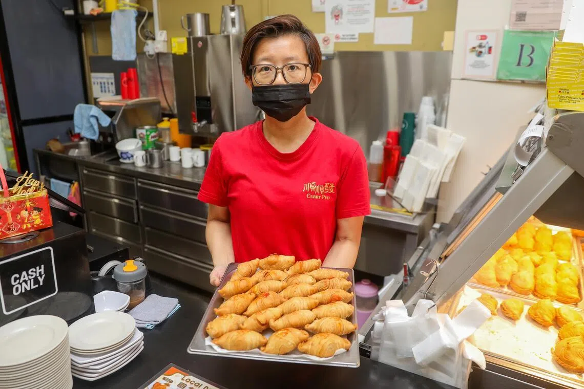 Pic1 to Pic3: Profile of Mdm Tay Meilan, 44, who is the third generation owner of Soon Soon Huat Curry Puff. Taken at 220E East Coast Road.