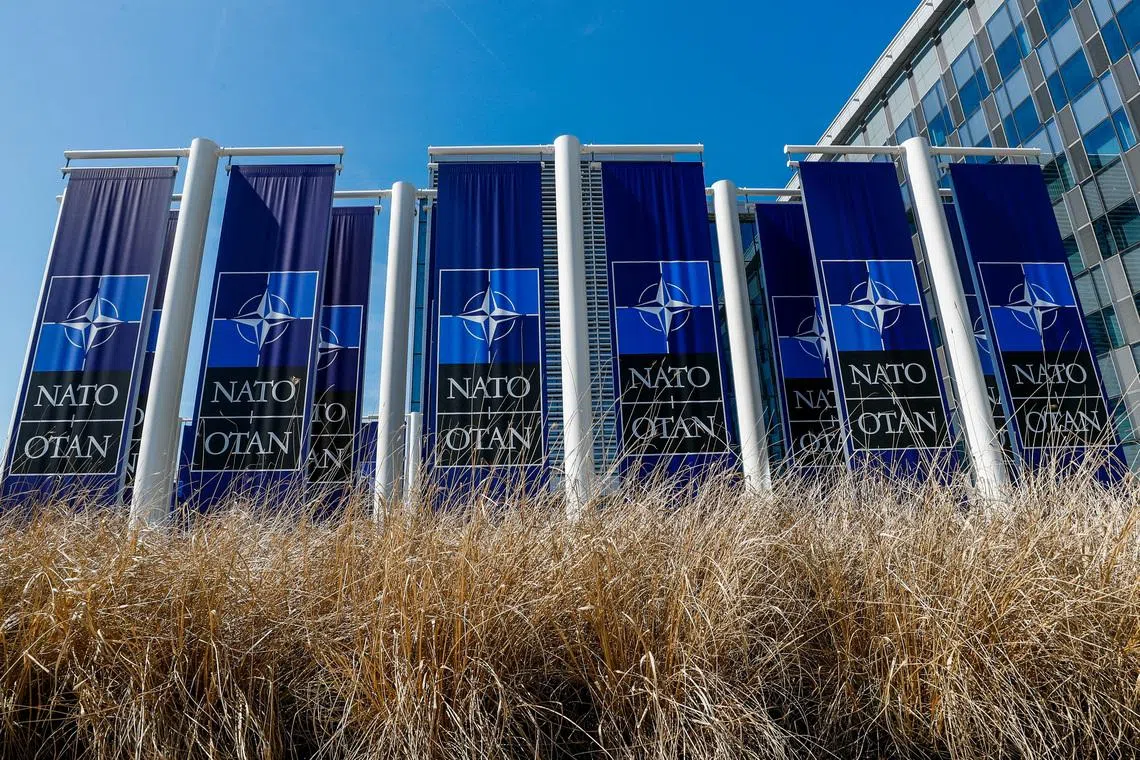 Banners displaying the NATO logo are placed at the entrance of new NATO headquarters during the move to the new building, in Brussels, Belgium April 19, 2018.  REUTERS/Yves Herman