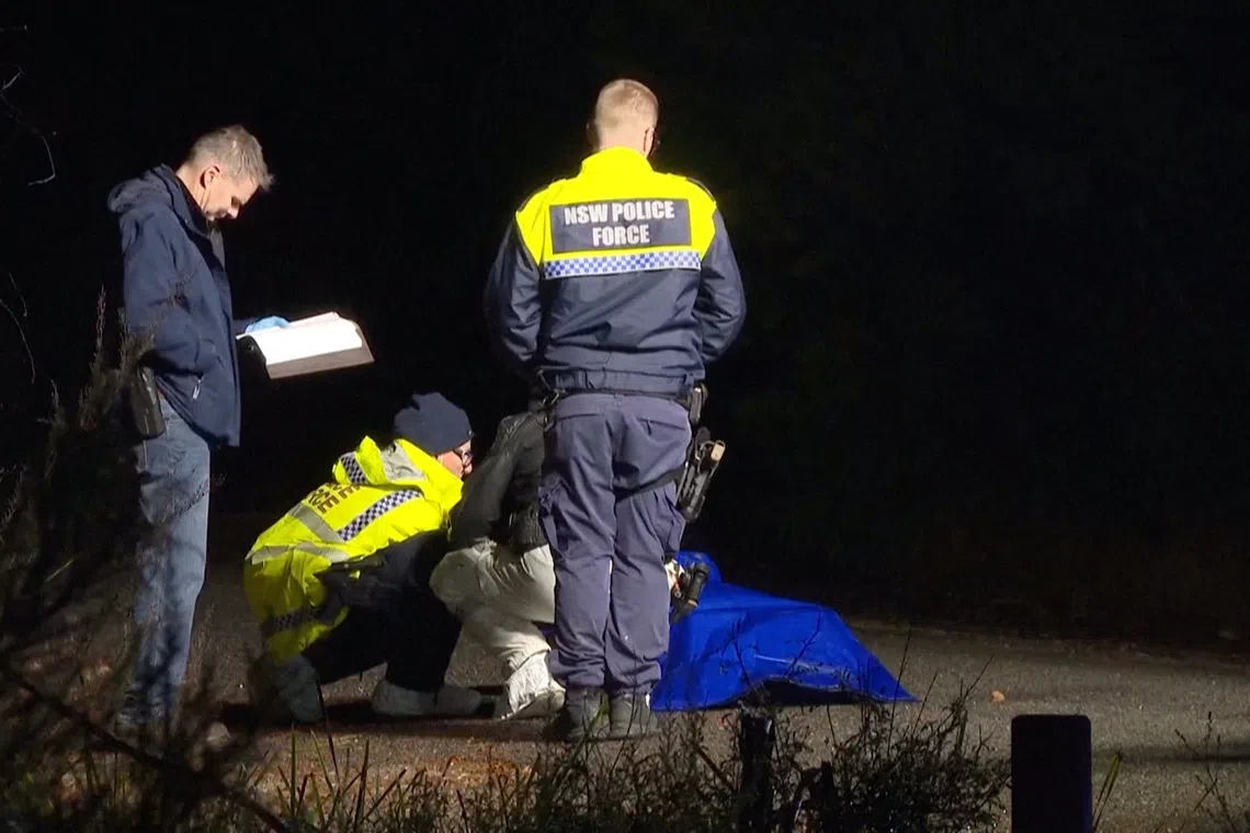 Police personnel present near a bag covered in plastic, the item in which was later determined as a life like doll and not remains of a human body, leading to the Australian police calling off a homicide investigation, in Oallen, New South Wales, Australia August 9, 2026, in this screengrab from a handout video. Australian Broadcasting Corporation/Handout via REUTERS