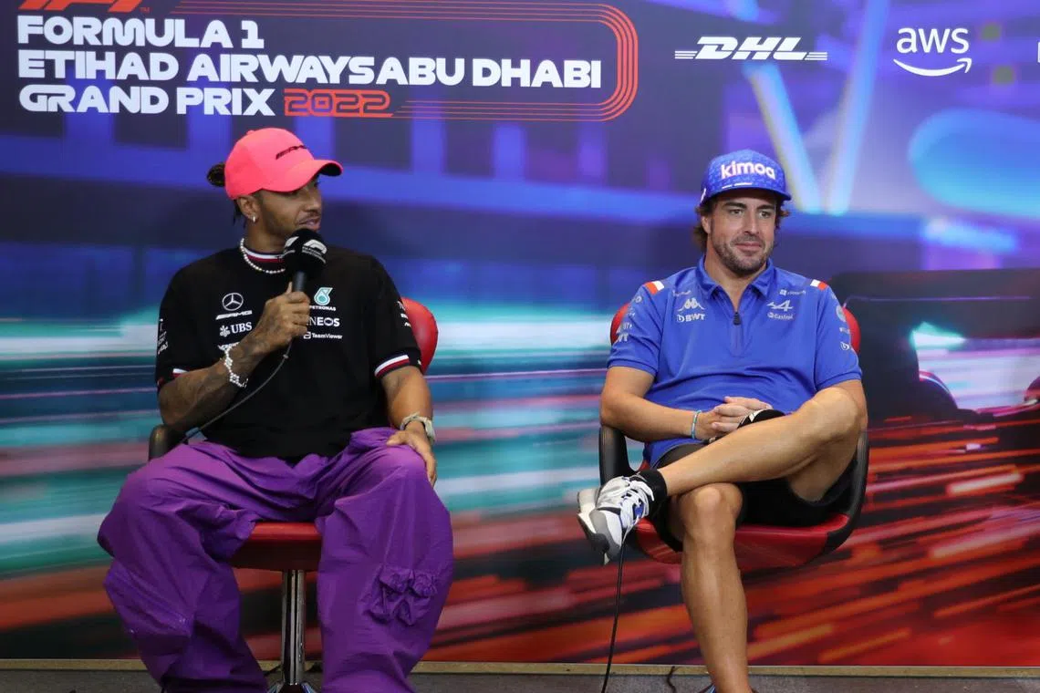 Mercedes driver Lewis Hamilton (left) and Alpine driver Fernando Alonso at a press conference in Abu Dhabi on Nov 17, 2022.