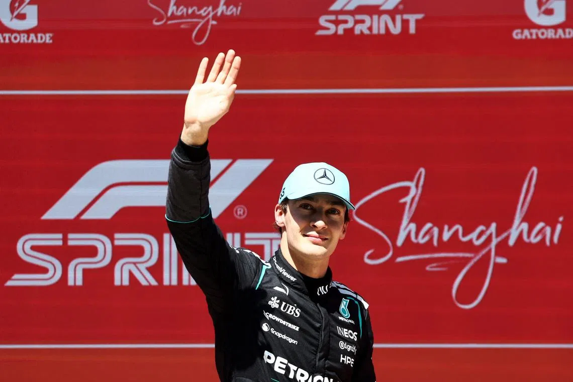 Formula One F1 - Chinese Grand Prix - Shanghai International Circuit, Shanghai, China - March 14, 2026 Mercedes' George Russell celebrates after winning the sprint race REUTERS/Jakub Porzycki