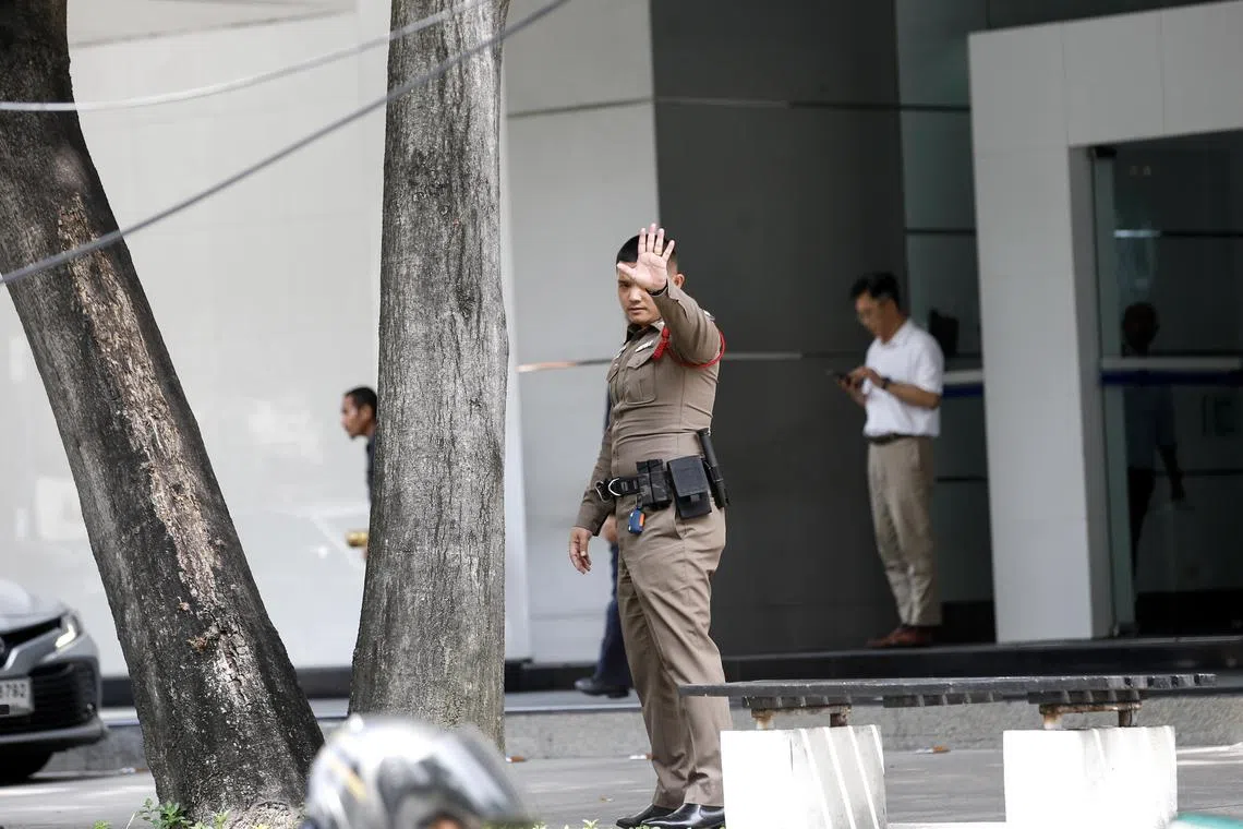 Thai police patrolling outside a building where the Israeli embassy is located in Bangkok on Oct 9, 2023.