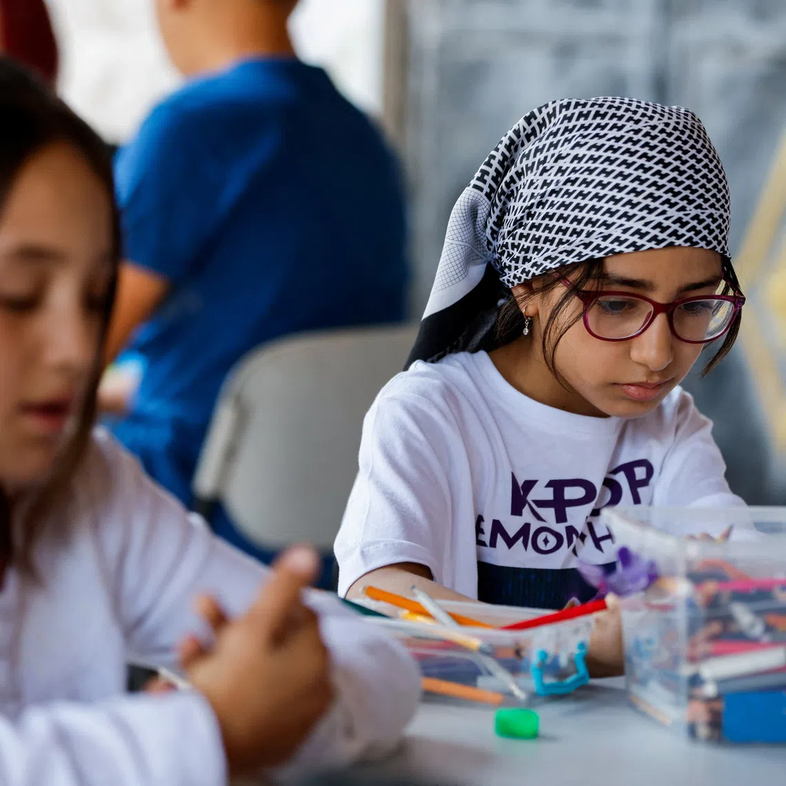 Palestinian children draw at Rommana studio in Hebron, in the Israeli-occupied West Bank, September 22, 2026. REUTERS/Mussa Qawasma
