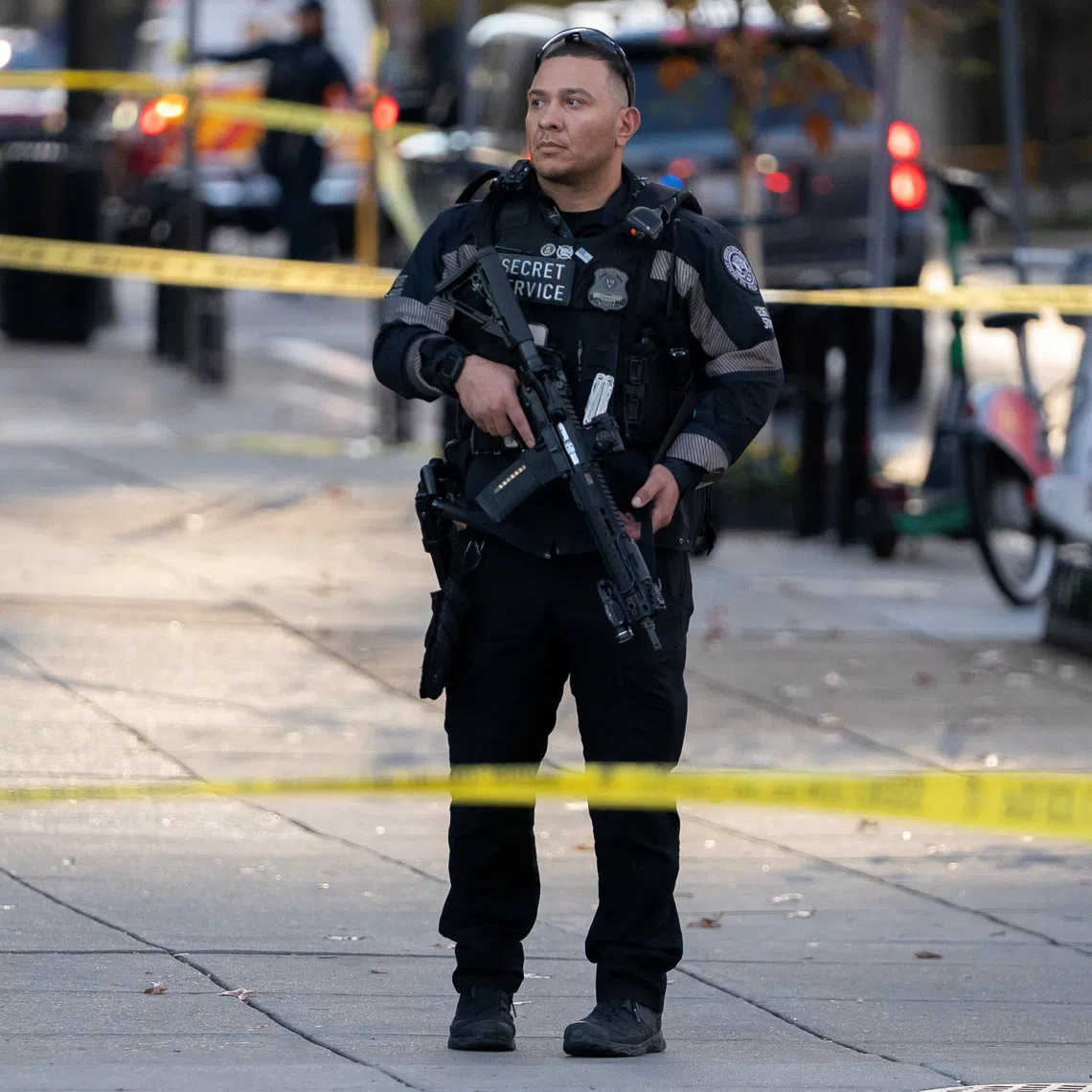 A member of the U.S. Secret Service stands guard in a cordoned-off area after two National Guard members were reportedly shot near the White House in Washington, D.C., U.S., November 26, 2025. REUTERS/Nathan Howard