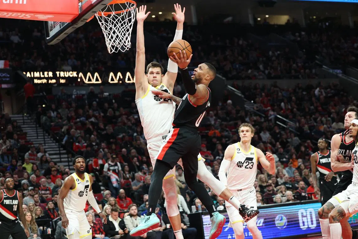 Portland Trail Blazers guard Damian Lillard shoots over Utah Jazz forward Jarred Vanderbilt in the second half at Moda Centre.