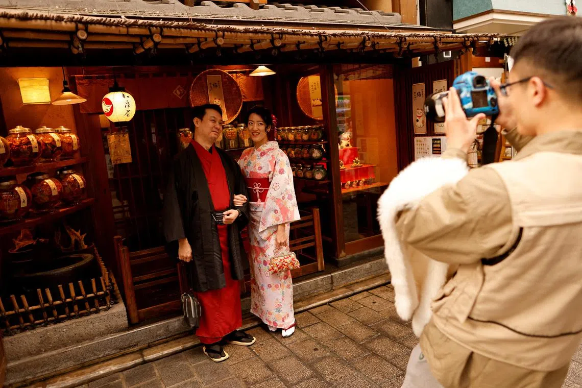 Tourists from Taiwan wearing Japanese traditional kimono clothes at Asakusa district, Tokyo, on Jan 9, 2023.