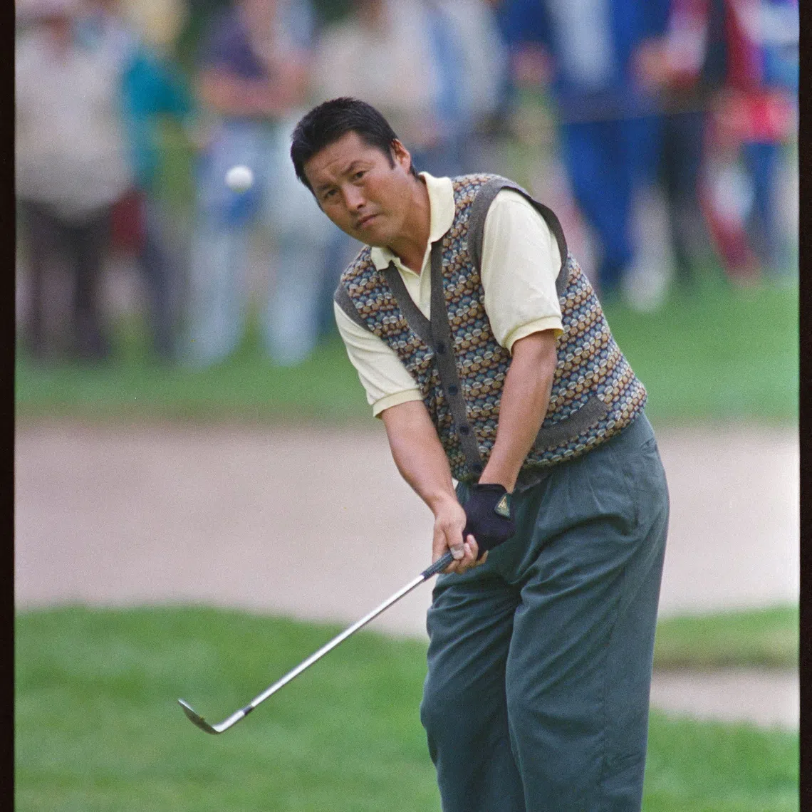 FILE PHOTO: Masashi Ozaki chips onto 3rd green during US Open golf Championship.  June 15, 1989 REUTERS/Mike Blake 90045089  BALL FULL LENGTH GOLF JAPAN MAN NY ROCHESTER US OPEN; Ozaki, Masashi  Masashi Ozaki  DISCLAIMER: The image is presented in its original, uncropped, and untoned state. Due to the age and historical nature of the image, we recommend verifying all associated metadata, which was transferred from the index stored by the Bettmann Archives, and may be truncated./File Photo