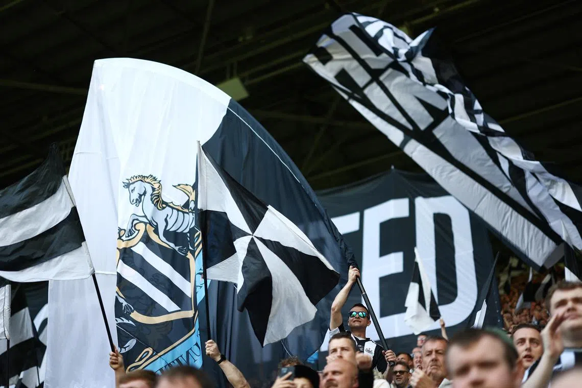 FILE PHOTO: Soccer Football - Premier League - Newcastle United v Chelsea - St James' Park, Newcastle, Britain - May 11, 2025 Newcastle United fans with flags inside the stadium before the match Action Images via Reuters/Lee Smith/ File Photo