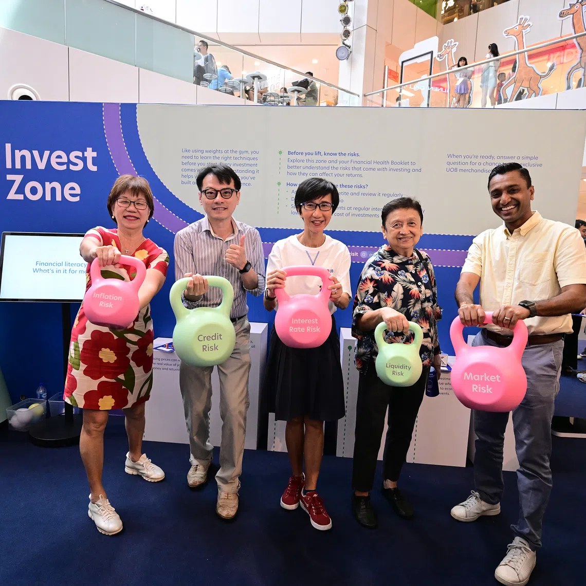 Central District Mayor Denise Phua (left) and Ms Janet Young (centre), UOB’s head of group channels and digitalisation, strategic communications and brand, at the Financial Fitness Festival on Sept 27.