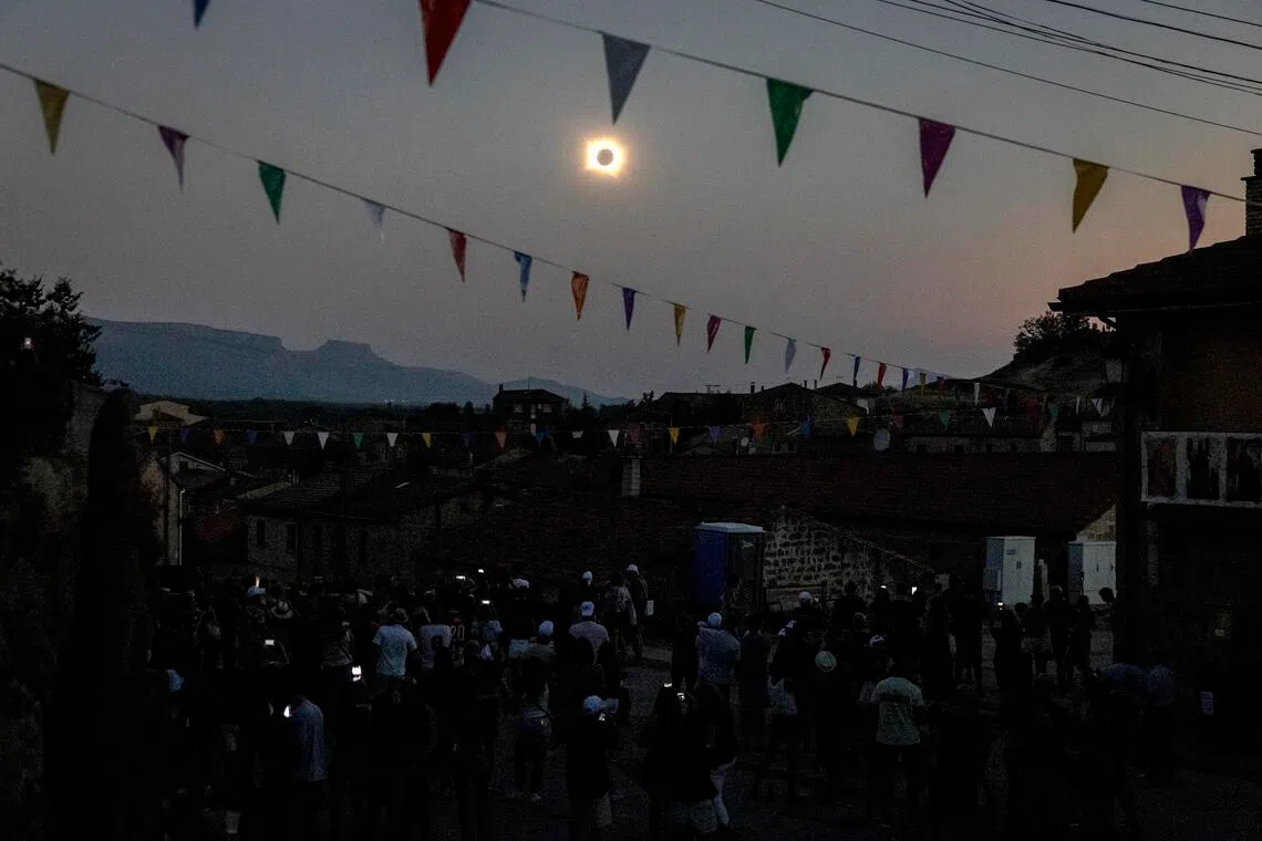From Iceland to Spain, people flocked to viewing spots to see the moon completely block out the sun.