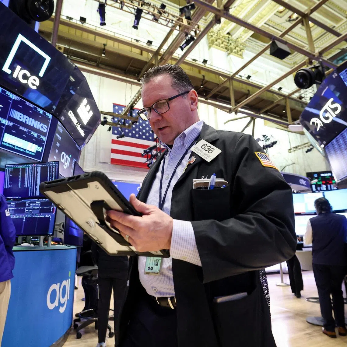 Traders working on the floor of the New York Stock Exchange, in New York City, on Feb 11.