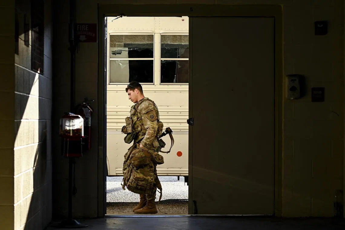 A soldier in Fort Bragg, North Carolina, preparing to deploy to Eastern Europe in response to the Russia-Ukraine conflict on Feb. 14, 2022.
