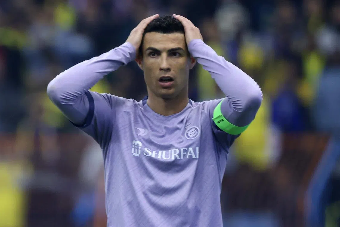 Al Nassr's Cristiano Ronaldo reacts to a missed chance during the Saudi Super Cup semi-final football match between Al Ittihad and Al Nassr.