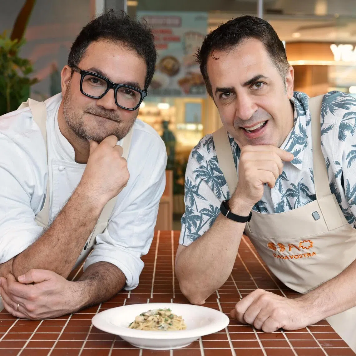 Italian chef Luciano Monosilio (left), dubbed the King of Carbonara, has trained chefs at chef Antonio Miscellaneo's Casa Vostra outlet at Tampines Mall to make his famous Spaghetti Alla Carbonara. 