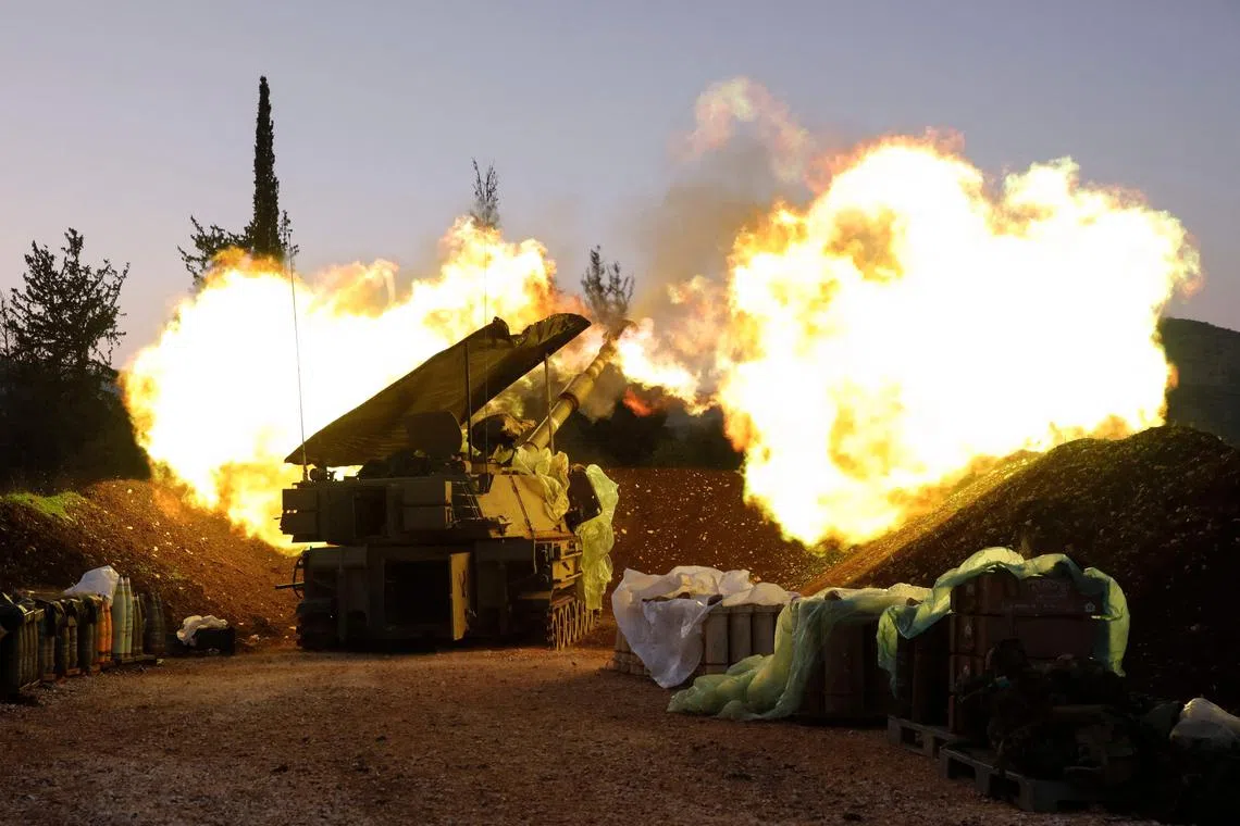 An Israeli artillery unit fires from a position in Upper Galilee in northern Israel towards southern Lebanon, on Dec 11.