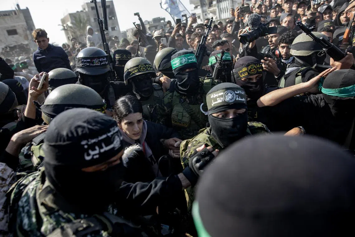 Palestinian militants released Israeli hostage Arbel Yehud to the International Committee of the Red Cross,  in the southern Gaza Strip on Jan 30.