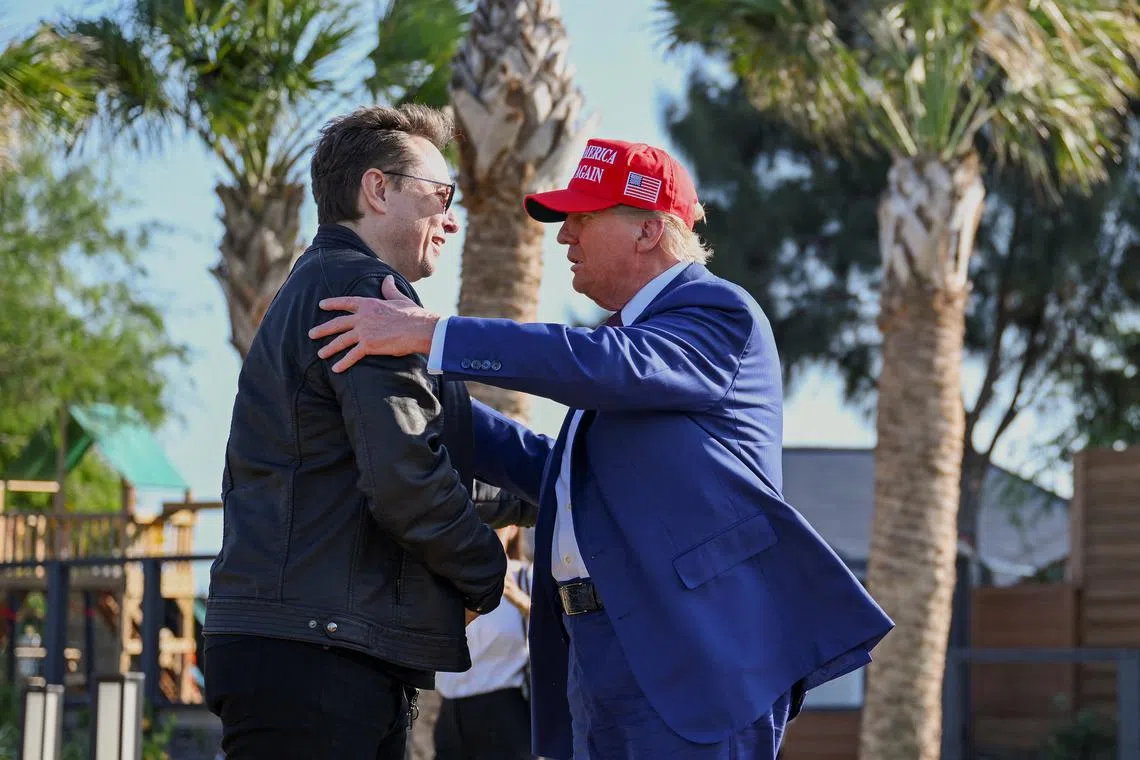 U.S. President-elect Donald Trump greets Elon Musk before attending a viewing of the launch of the sixth test flight of the SpaceX Starship rocket, in Brownsville, Texas, U.S., November 19, 2024 . Brandon Bell/Pool via REUTERS/File Photo