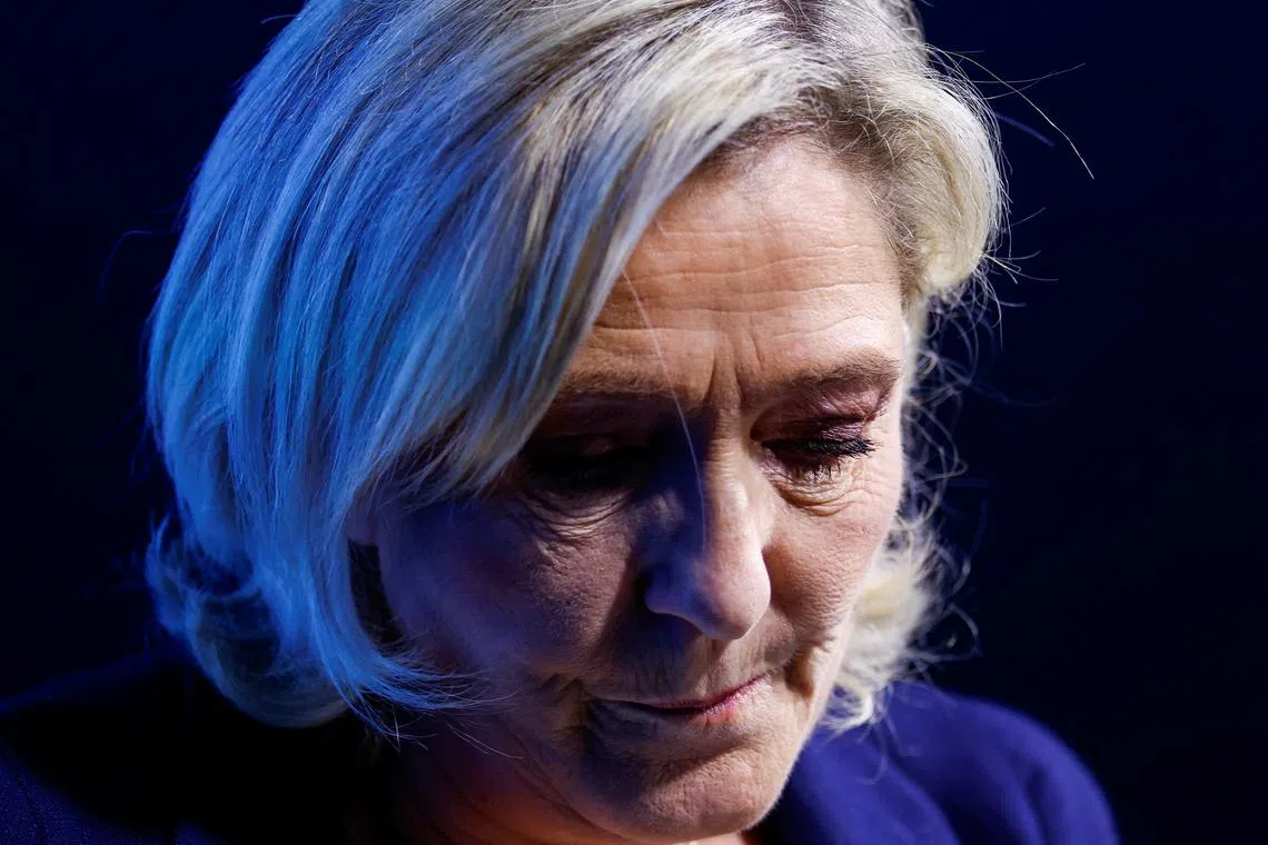 FILE PHOTO: French far-right leader and member of parliament Marine Le Pen, President of the French far-right National Rally (Rassemblement National - RN) party parliamentary group, looks on at a political rally in Etrepagny, France, December 15, 2024. REUTERS/Stephanie Lecocq/File Photo