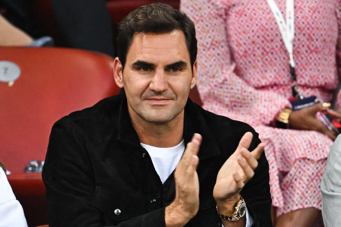 Former Swiss tenis player Roger Federer applauds during the Diamond League athletics meeting at Stadion Letzigrund stadium in Zurich on August 31, 2023. (Photo by Fabrice COFFRINI / AFP)