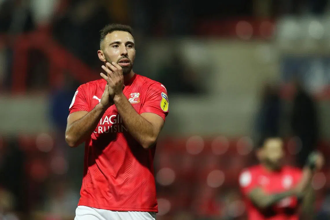 FILE PHOTO: Soccer Football - League Two - Swindon Town v Port Vale - The County Ground, Swindon, Britain - January 25, 2020   Swindon Town's Hallam Hope applauds the fans after the match   Action Images/John Clifton