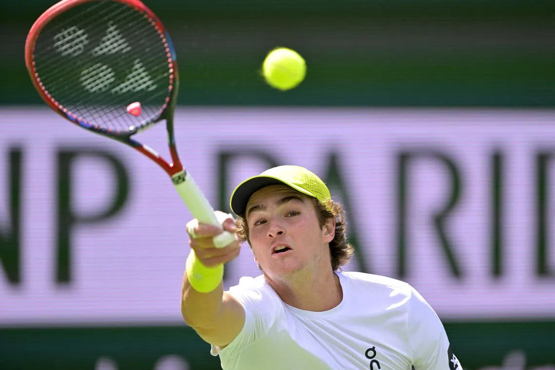 Mar 6, 2025; Indian Wells, CA, USA;  Joao Fonseca (BRA) hits a shot during his first round match as he defeated Jacob Fearnley (not pictured) in the BNP Paribas Open at the Indian Well Tennis Garden. Mandatory Credit: Jayne Kamin-Oncea-Imagn Images