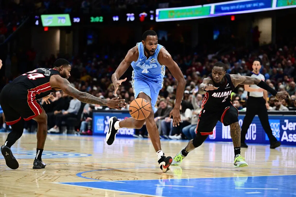 Cleveland Cavaliers forward Evan Mobley drives to the basket between Miami Heat forward Haywood Highsmith and guard Terry Rozier during the second half at Rocket Arena. 