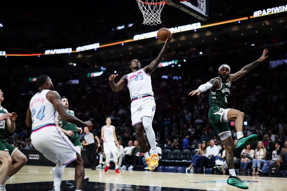 Davion Mitchell of the Miami Heat makes a layup during the fourth quarter against the Milwaukee Bucks at Kaseya Centre.