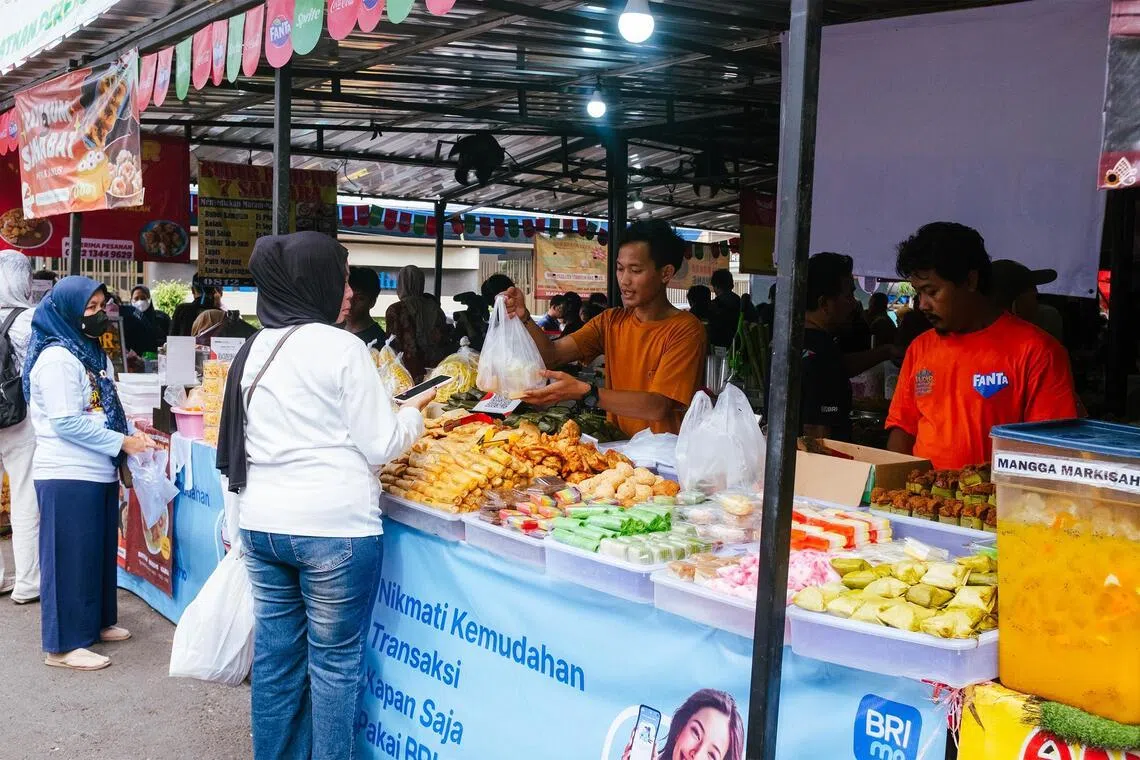 In Indonesia, non-Muslims join race to buy Ramadan bazaar snacks