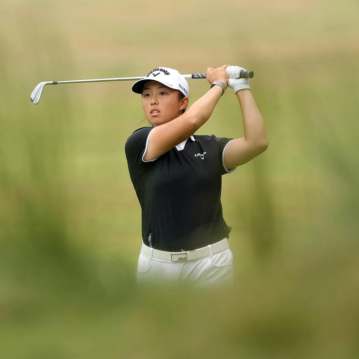 Eventual champion Yin Ruoning of China plays a shot on the 18th hole during the final round of the FM Championship at TPC Boston on Aug 30.