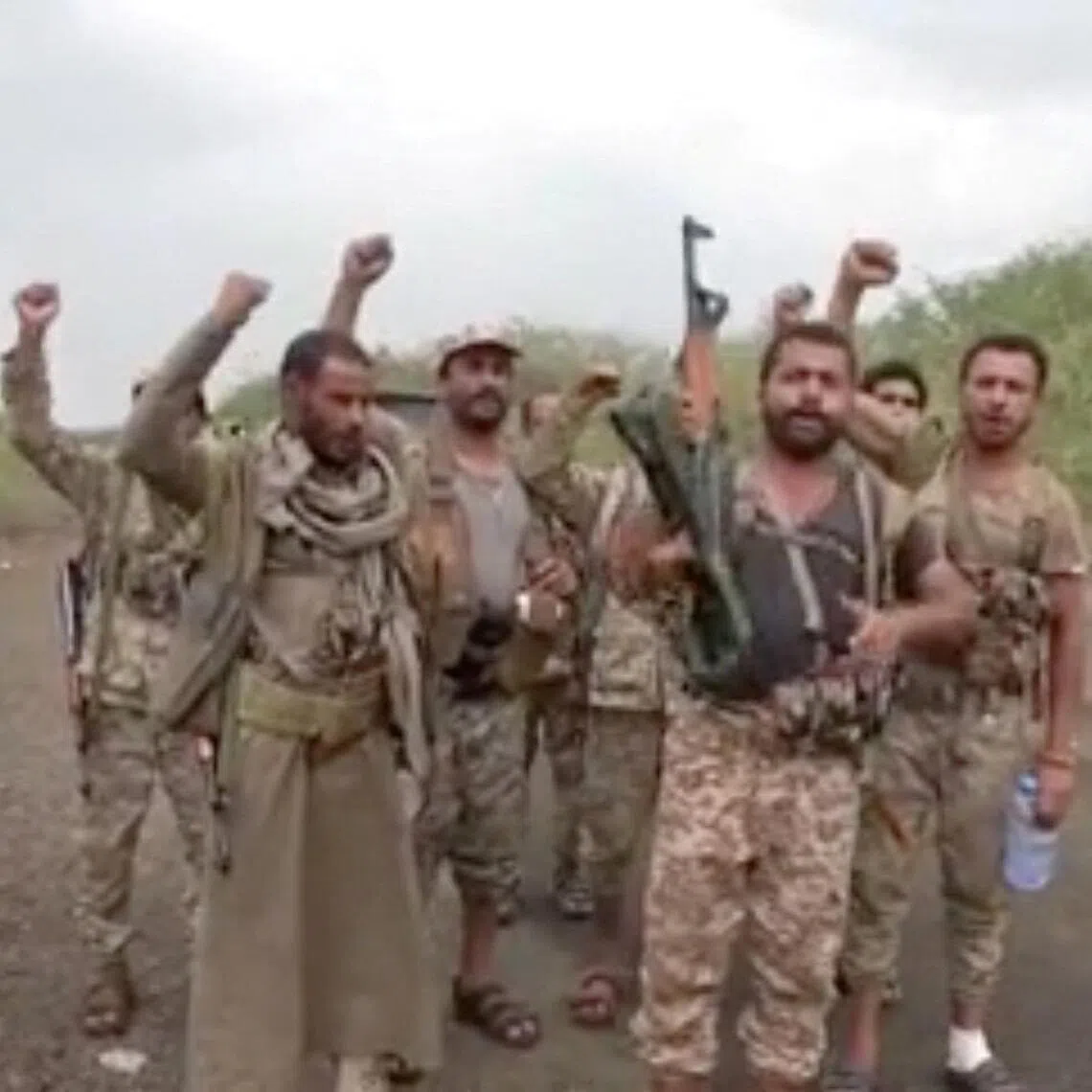 A screengrab from video shows men gesturing after Houthis captured the city of Mokha in Yemen’s Taiz Province.
