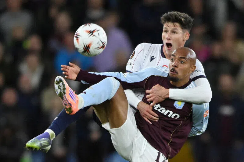 Bologna's Martin Vitik in action with Aston Villa's Donyell Malen during the UEFA Europa League held at the Villa Park, in Birmingham, Britain, on Sept 25, 2025.