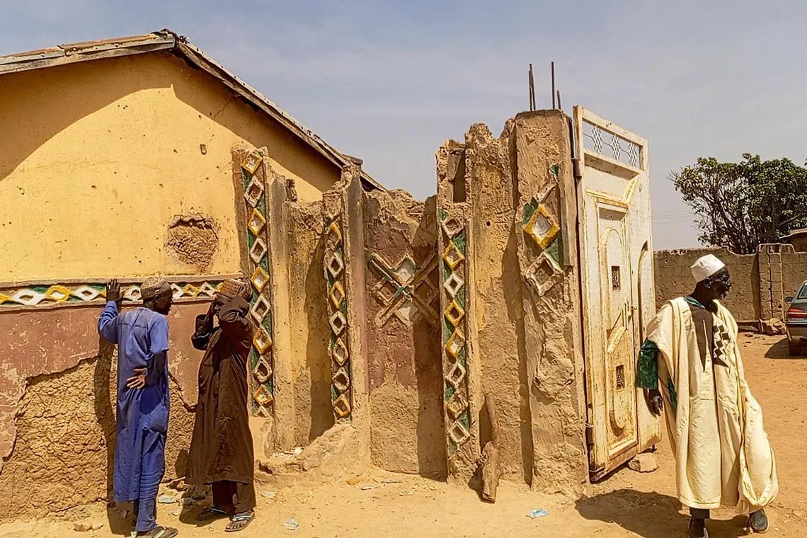 Members of the local community gather outside the residence of the Emir of Tafoki to offer condolences following a deadly raid carried out by armed gunmen from a local gang, in Doma, Katsina State, Nigeria, February 4, 2026. Picture taken with a phone. REUTERS/Stringer