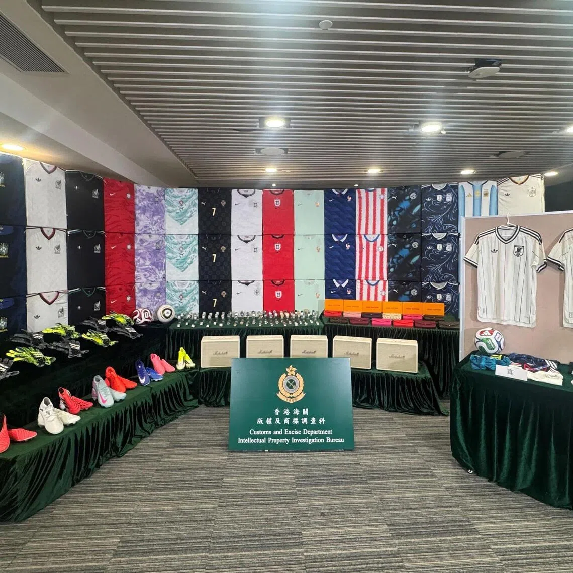 This handout photo released on June 11, 2026, by the Hong Kong Customs and Excise Department shows suspected counterfeit football jerseys and other goods related to World Cup teams seized by authorities in Hong Kong. Hong Kong officials said June 11 they had arrested six people in a World Cup fake merchandise sting involving almost 20 million USD of counterfeit goods. (Photo by Handout / Hong Kong Customs and Excise Department / AFP) / -----EDITORS NOTE --- RESTRICTED TO EDITORIAL USE - MANDATORY CREDIT "AFP PHOTO / Hong Kong Customs and Excise Department " - NO MARKETING - NO ADVERTISING CAMPAIGNS - DISTRIBUTED AS A SERVICE TO CLIENTS