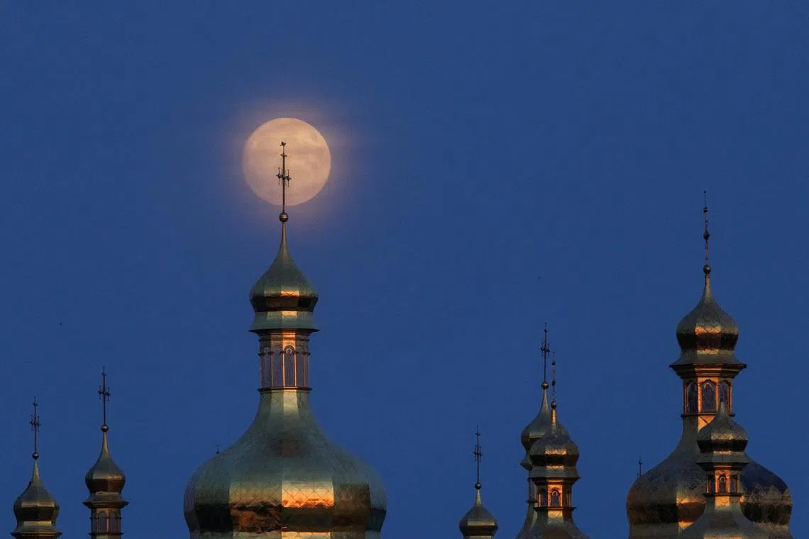 A full moon rises over the Kyiv-Pechersk Lavra monastery, which was recently damaged during Russian missile and drone strikes amid Russia's attack on Ukraine, in Kyiv, Ukraine June 28, 2026. REUTERS/Valentyn Ogirenko TPX IMAGES OF THE DAY
