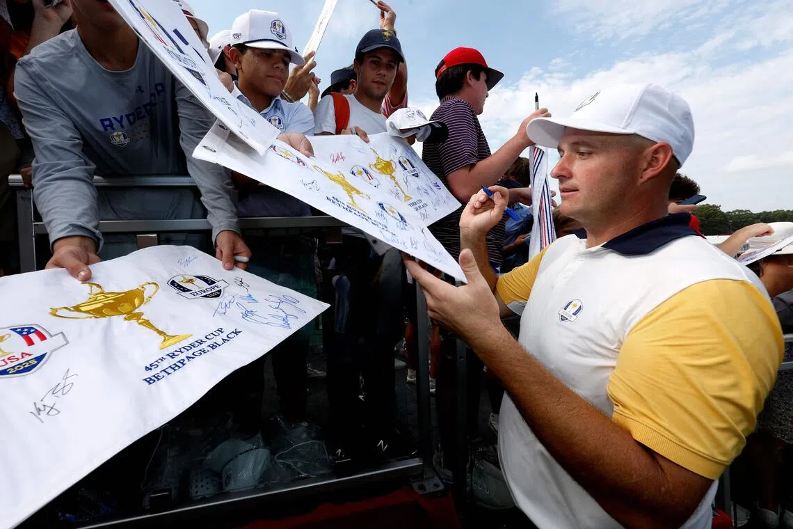 Scottie Scheffler of Team United States signing autographs for fans before the 2025 Ryder Cup at Black Course at Bethpage State Park Golf Course on Sept 23, 2025 in Farmingdale, New York.