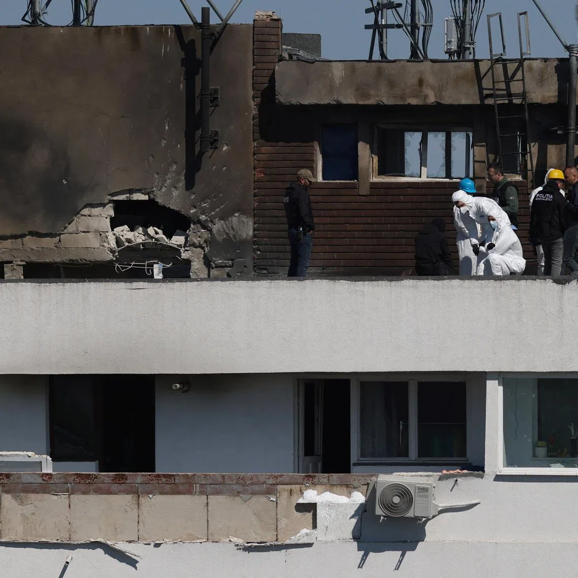 Romanian law enforcement officers work at the site of an explosion in a residential block of flats following a reported drone strike near the border with Ukraine, in Galati, Romania, May 29, 2026. Inquam Photos/George Calin via REUTERS