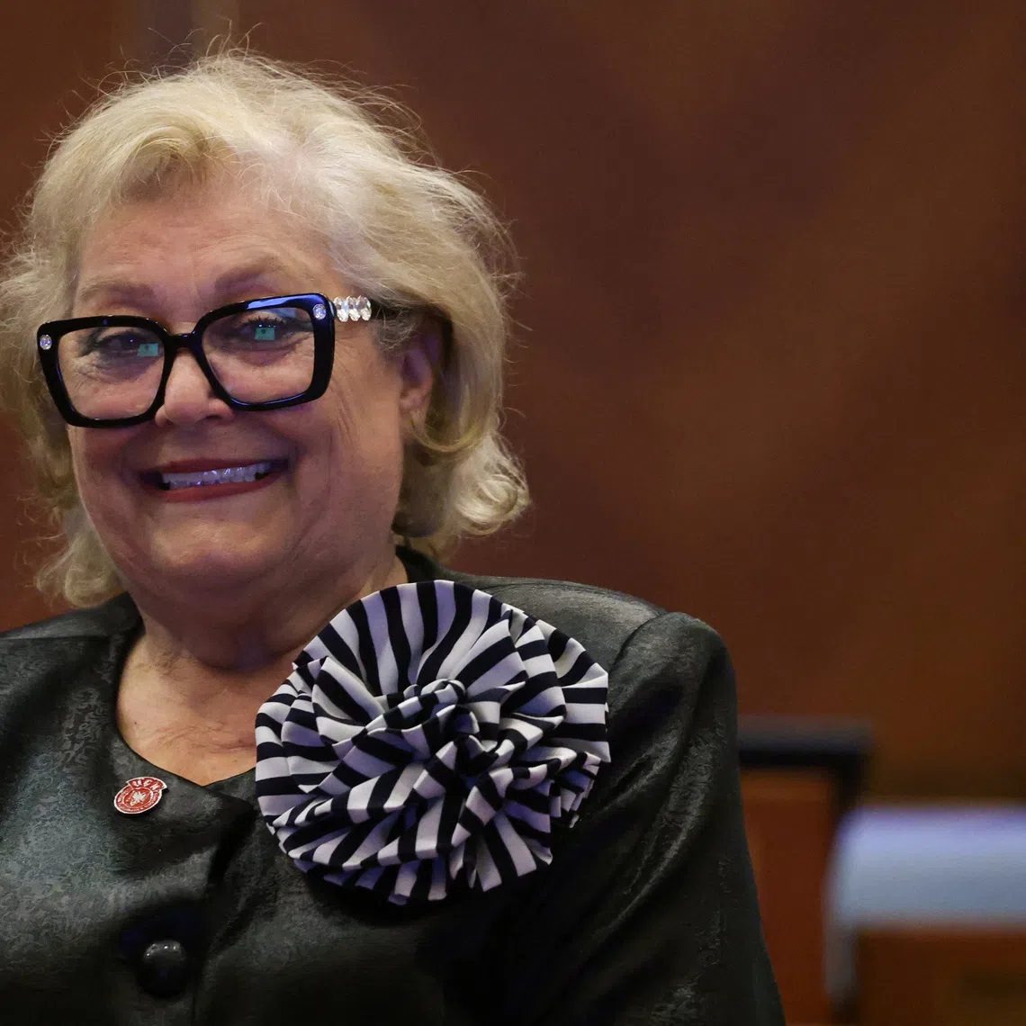 The newly elected President of the Republic of Kosovo Justina Shiroka Pula poses for pictures at the parliament in Pristina, Kosovo, October 7, 2026. REUTERS/Valdrin Xhemaj