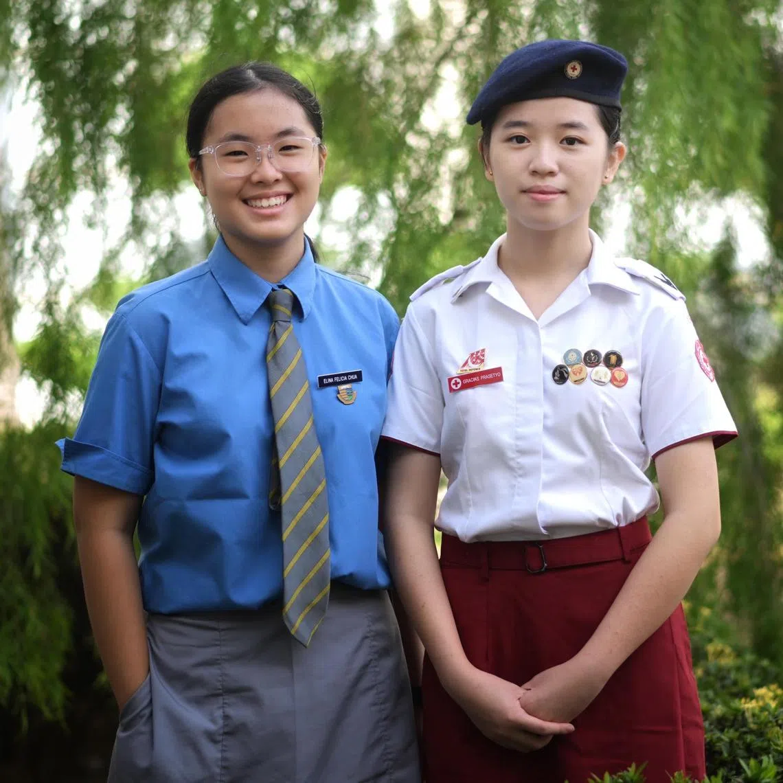 From left: profile photo of Cedar Girls' Secondary School students Elina Chua, 13 and Gracias Prasetyo, 16, on Feb 7, 2025. They performed CPR compression while applying AED on a cardiac arrest casualty on Feb 4.