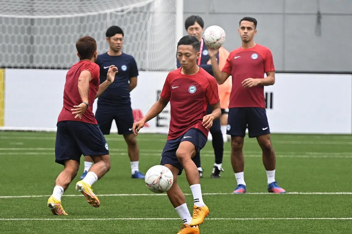 Lions winger Shawal Anuar (in orange boots) training at Jalan Besar Stadium on Thursday ahead of their AFF clash with Vietnam. 