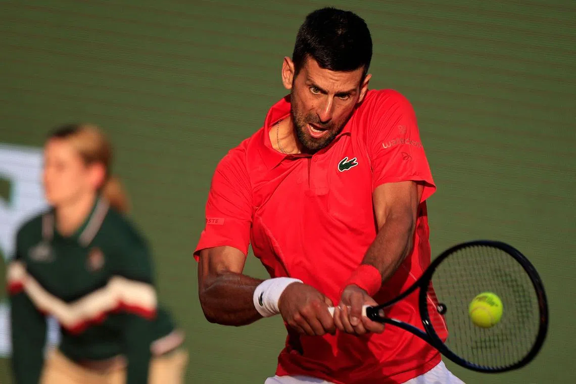Serbia's Novak Djokovic plays a backhand return to Norway's Casper Ruud during their Monte Carlo Masters semi-final tennis match on the Rainier III court at the Monte Carlo Country Club on April 13. The world No. 1 lost 6-4, 1-6, 6-4.