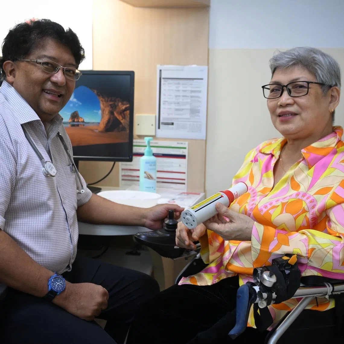 NHG Health’s chief of health services and outcomes research John Abisheganaden examining Madam Merly Hong, a patient with Tan Tock Seng Hospital since 2016.