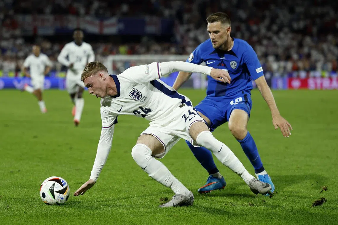 Soccer Football - Euro 2024 - Group C - England v Slovenia - Cologne Stadium, Cologne, Germany - June 25, 2024  England's Cole Palmer in action with Slovenia's Timi Max Elsnik REUTERS/John Sibley